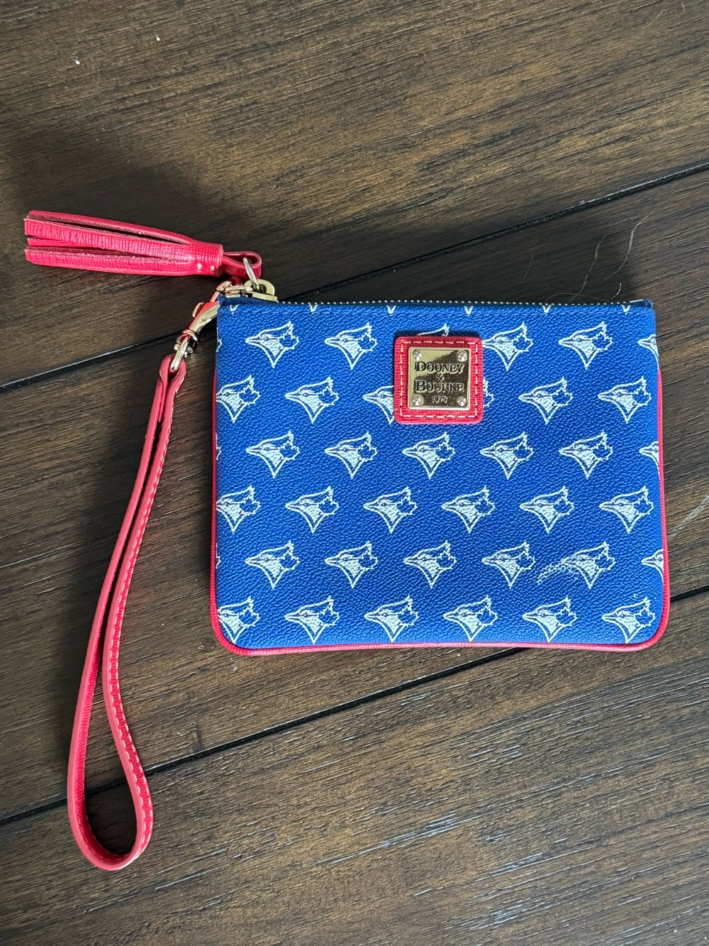 Dooney & Bourke Blue Wristlet with Red Trim and Tassel